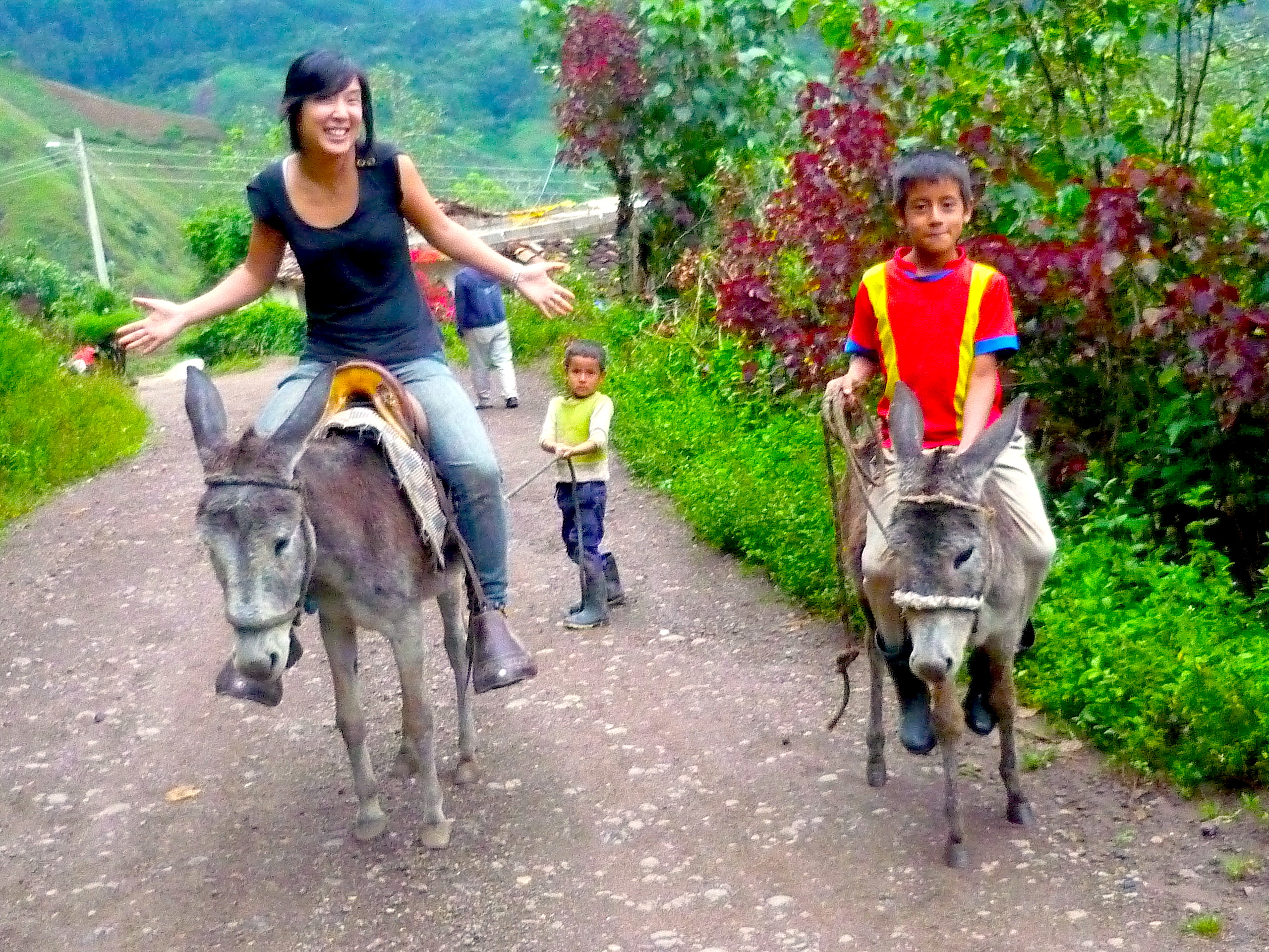 'Cause Missionaries ride donkeys and take photos with ethnic kids ... right? (The lack of a Bible in my hand must make me a bad, weaponless missionary)